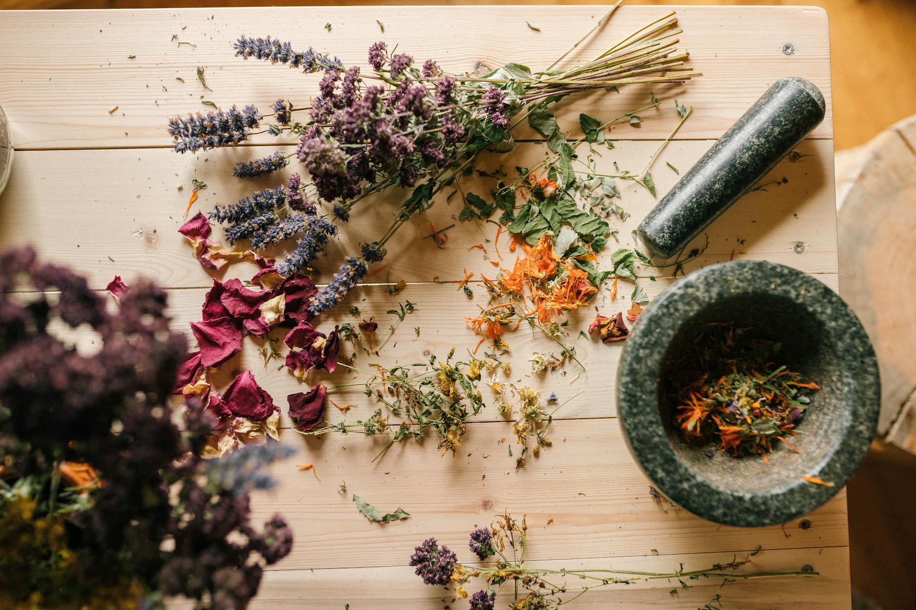 purple flowers on brown wooden table